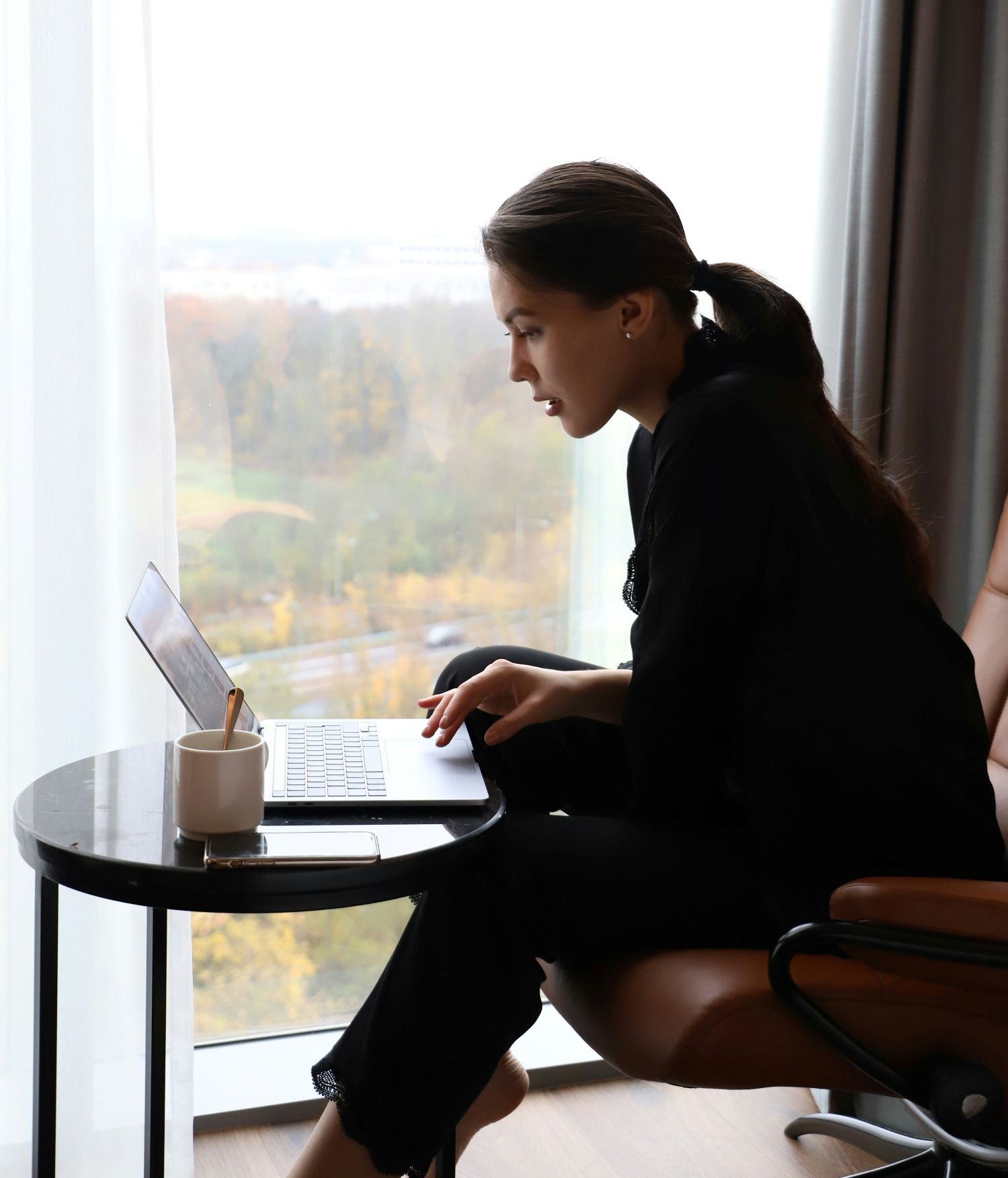 Woman intent on a report on her computer